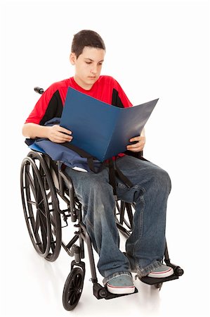 Disabled teen school boy reading in his wheelchair.  Full body isolated. Stock Photo - Budget Royalty-Free & Subscription, Code: 400-04200051