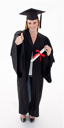 Teenage Girl Celebrating Graduation agaisnt white background with thumbs up Stock Photo - Budget Royalty-Free & Subscription, Code: 400-04200206