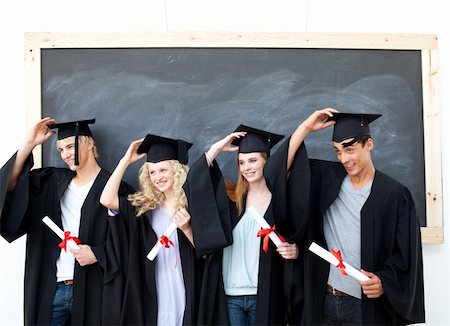 simsearch:400-04705218,k - Happy group of teenagers celebrating after Graduation Stockbilder - Microstock & Abonnement, Bildnummer: 400-04200220