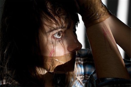 young woman taken hostage with her mouth gagged Photographie de stock - Aubaine LD & Abonnement, Code: 400-04200336