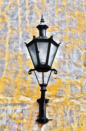pictures of house street lighting - old lantern on yellow wall in street of Tallin old town, Estonia Stock Photo - Budget Royalty-Free & Subscription, Code: 400-04200390