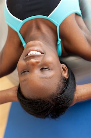 pilates african american - Smiling ethnic woman working out with a pilates ball at home Stock Photo - Budget Royalty-Free & Subscription, Code: 400-04200647