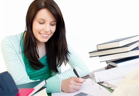 simsearch:400-04484714,k - Smiling teen girl studying on a desk at home Stock Photo - Budget Royalty-Free & Subscription, Code: 400-04200672