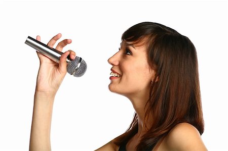 closeup of pretty brunette with silver mic in hand isolated Photographie de stock - Aubaine LD & Abonnement, Code: 400-04200809