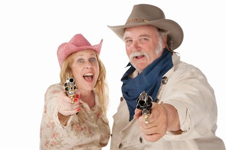 funny old men crazy - Couple in western wear pointing pistols and laughing Foto de stock - Super Valor sin royalties y Suscripción, Código: 400-04201098