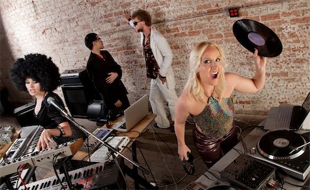 rock band four men - Female DJ holding a record and shouting Stock Photo - Budget Royalty-Free & Subscription, Code: 400-04201091