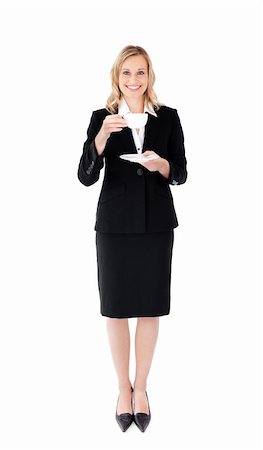 simsearch:400-05242665,k - A happy businesswoman holding a cup of tea wearing a black suit Foto de stock - Super Valor sin royalties y Suscripción, Código: 400-04201145