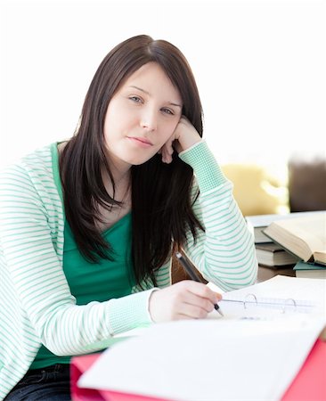 simsearch:400-04484714,k - Tired attractive student sleeping while doing her homework in the living-room Stock Photo - Budget Royalty-Free & Subscription, Code: 400-04201159