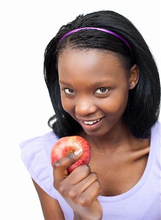simsearch:400-04564926,k - Attractive young woman eating an apple against a white background Photographie de stock - Aubaine LD & Abonnement, Code: 400-04201165