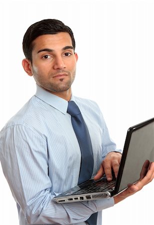 simsearch:400-07514126,k - A businessman in blue pinstripe shirt holding a laptop computer.   White background. Fotografie stock - Microstock e Abbonamento, Codice: 400-04201547