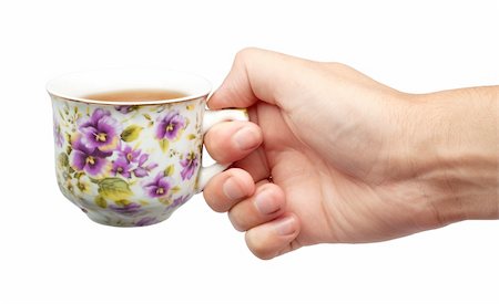 simsearch:400-05311347,k - A cup of tea and a hand isolated on white background Stock Photo - Budget Royalty-Free & Subscription, Code: 400-04201660