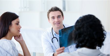 doctor showing results to patient - Medical partners explainng the results to the patient at the hospital Stock Photo - Budget Royalty-Free & Subscription, Code: 400-04201855