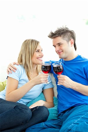 divert - Beautiful couple drinking wine together in the living-room at home Stock Photo - Budget Royalty-Free & Subscription, Code: 400-04202087