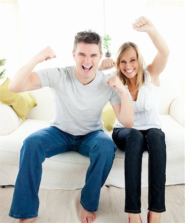 simsearch:400-04202081,k - Charming couple having free time together in the living-room Foto de stock - Royalty-Free Super Valor e Assinatura, Número: 400-04202123