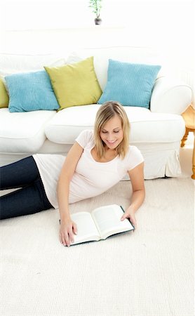 divert - Beautiful woman is reading a book  in the living-room Stock Photo - Budget Royalty-Free & Subscription, Code: 400-04202137