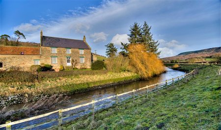 simsearch:400-06919516,k - Farmhouse in the countryside next to a small stream Stock Photo - Budget Royalty-Free & Subscription, Code: 400-04202460