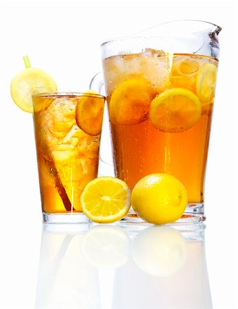 simsearch:400-04522626,k - Stock image of pitcher and glass of Iced tea garnished with lemons over white background with reflection on bottom, could be Long Island Iced Tea. Find more cocktail and prepared drinks images on my portfolio. Photographie de stock - Aubaine LD & Abonnement, Code: 400-04202486