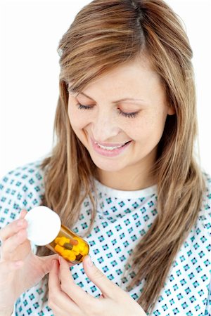 simsearch:400-05892402,k - Ill young woman holding  pills against white background Stock Photo - Budget Royalty-Free & Subscription, Code: 400-04202991