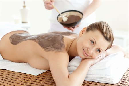 simsearch:400-04192063,k - Happy woman enjoying a mud skin treatment in a Spa center Fotografie stock - Microstock e Abbonamento, Codice: 400-04203039