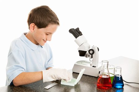 school science lab gloves - Cute little boy in science class sorts through microscope slides. The top one is labeled pollen.  White background. Stock Photo - Budget Royalty-Free & Subscription, Code: 400-04203278