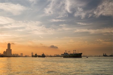 Kaohsiung city morning with color sunrise and clouds and boats on water of ocean. Stock Photo - Budget Royalty-Free & Subscription, Code: 400-04203973