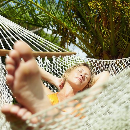 female legs in hammock - woman relaxing on hammock with eyes closed. Front view, Square  shape Stock Photo - Budget Royalty-Free & Subscription, Code: 400-04214186