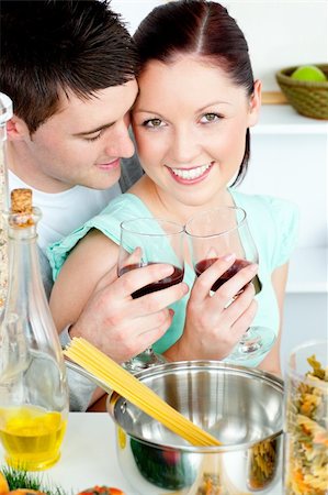 Loving young couple cooking spaghetti in the kitchen at home Stock Photo - Budget Royalty-Free & Subscription, Code: 400-04214926