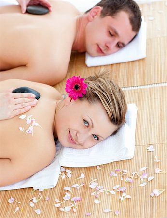 Relaxed young couple enjoying a back massage in a spa center Foto de stock - Super Valor sin royalties y Suscripción, Código: 400-04215064