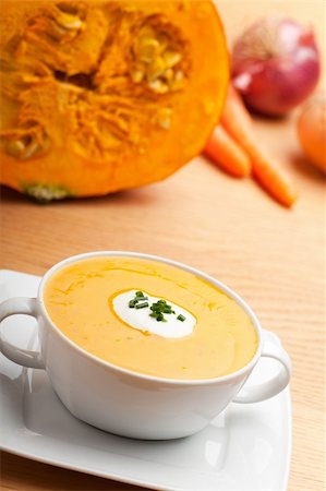 pumpkin soup in a white bowl Stock Photo - Budget Royalty-Free & Subscription, Code: 400-04215412