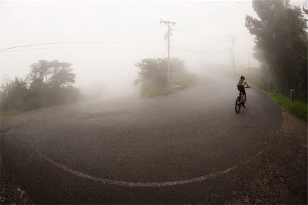 simsearch:400-04729405,k - Bicyclist in the Costa Rican cloud forest near Monteverde Photographie de stock - Aubaine LD & Abonnement, Code: 400-04215433