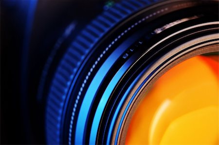 Close-up of a lens attached to a modern digital camera Fotografie stock - Microstock e Abbonamento, Codice: 400-04215521