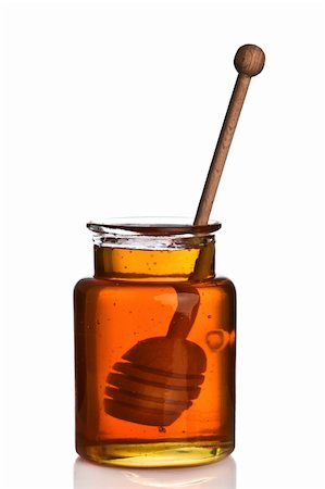 Honey in a glass jar with wooden dripper inside Fotografie stock - Microstock e Abbonamento, Codice: 400-04215523