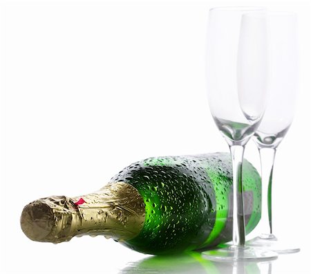 Cold wet bottle of champagne with two empty glasses Stock Photo - Budget Royalty-Free & Subscription, Code: 400-04215954