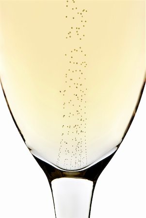 Rising bubbles in a champagne glass with white background Fotografie stock - Microstock e Abbonamento, Codice: 400-04215963