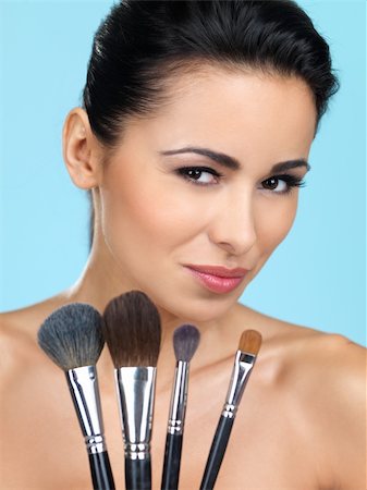 simsearch:400-04129614,k - Portrait of beautiful woman she holding makeup brushes Stock Photo - Budget Royalty-Free & Subscription, Code: 400-04216026