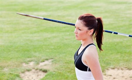 Concentrated female athlete ready to throw javelin in a stadium Stock Photo - Budget Royalty-Free & Subscription, Code: 400-04217233