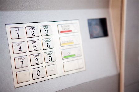 A close up detail of an outdoor bank machine; shallow depth of field with critical focus on middle row of numbers Fotografie stock - Microstock e Abbonamento, Codice: 400-04217364