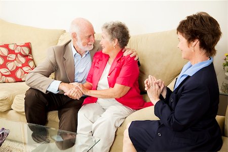 Therapist looks on as a senior couple she's been counseling works out their issues. Stock Photo - Budget Royalty-Free & Subscription, Code: 400-04217466