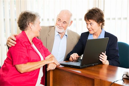 financial advisor talking to couple - Senior couple with their financial advisor, going over their retirement income on her computer. Stock Photo - Budget Royalty-Free & Subscription, Code: 400-04217556