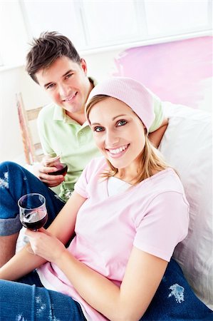 simsearch:400-04878558,k - Joyful couple lying on the sofa after painting their new room in their new house Stock Photo - Budget Royalty-Free & Subscription, Code: 400-04217598