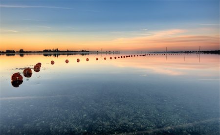 sunset family seascape - Fishing net a nice quiet morning Stock Photo - Budget Royalty-Free & Subscription, Code: 400-04217803