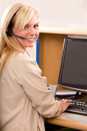 simsearch:400-04472832,k - A happy bonde recpetionist with a phone headset Stock Photo - Budget Royalty-Free & Subscription, Code: 400-04218071