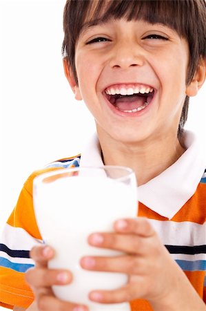 simsearch:400-04218582,k - Smiling young boy holding a glass of milk over a isolated white background Stockbilder - Microstock & Abonnement, Bildnummer: 400-04218582