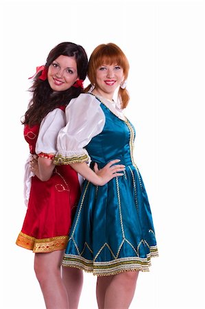 Two German/Bavarian girl s with a traditional Oktoberfest "Ma?krug. Smiling woman in Bavarian drindl Foto de stock - Super Valor sin royalties y Suscripción, Código: 400-04219129