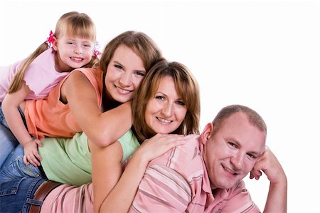 Happy family. Mother, father and two daughter are smiling . Woman, man and girls are lying on the floor and posing happily. Foto de stock - Super Valor sin royalties y Suscripción, Código: 400-04219130