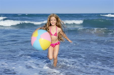 simsearch:400-04596901,k - Beach little girl colorful ball vacation playing in blue sea Stock Photo - Budget Royalty-Free & Subscription, Code: 400-04219291