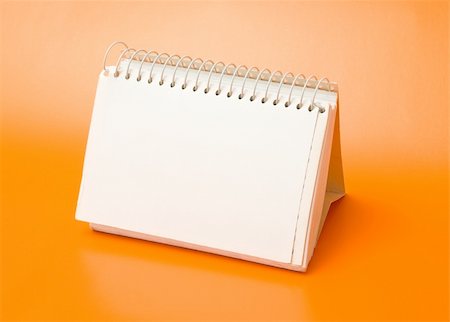 simsearch:400-04085316,k - blank spiral calendar over an orange background Stock Photo - Budget Royalty-Free & Subscription, Code: 400-04219336