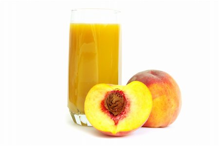 Glass with freshly made peach juice on a white background Photographie de stock - Aubaine LD & Abonnement, Code: 400-04219524