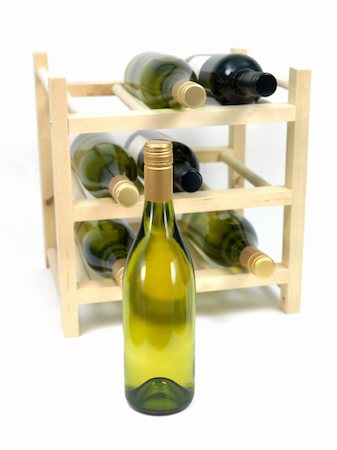 Bottled wine and a wine rack isolated against a white background Stock Photo - Budget Royalty-Free & Subscription, Code: 400-04219539