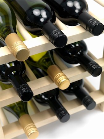 Bottled wine and a wine rack isolated against a white background Stock Photo - Budget Royalty-Free & Subscription, Code: 400-04219541